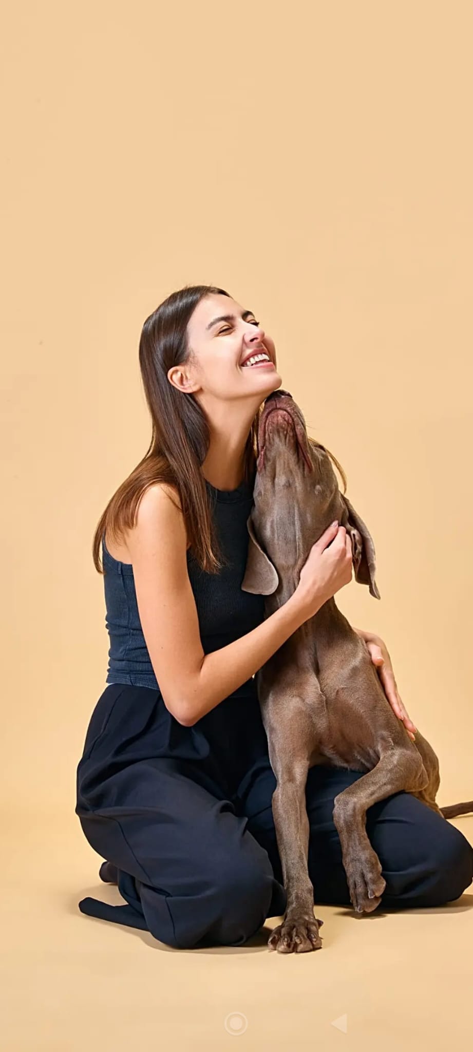 A woman holding her beloved dog, demonstrating a deep soul connection